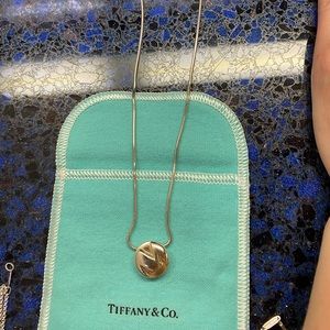 Tiffany & Co. “M” monogram necklace